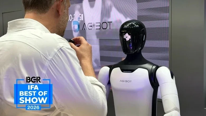 Archive photograph of an AGIBOT A3-series robot interacting with a visitor at IFA 2026, photographed by José Adorno for BGR. Not a photograph of the September service deployments.